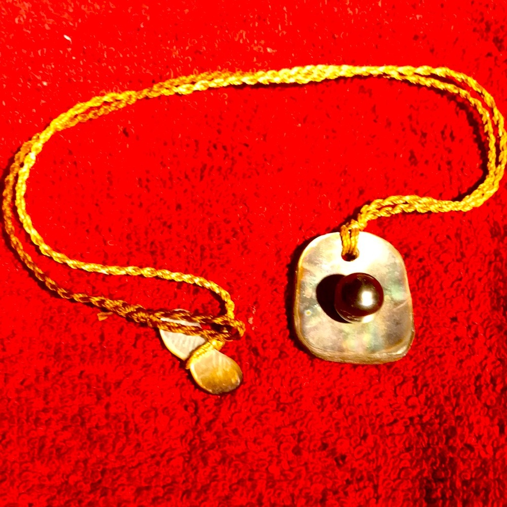 This is a lovely shell and Tahitian Pearl necklace
